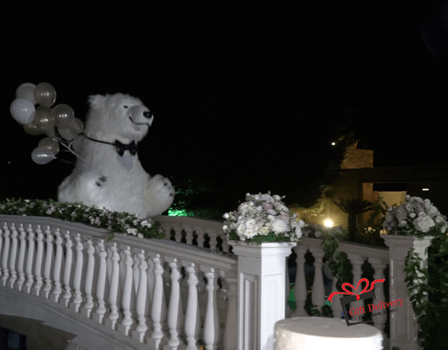 The White Polar Bear came to the wedding to deliver the gift to the bride and groom. Gift Delivery. Wedding gift. Surprise from the Political bear. White Polar Bear at the wedding.